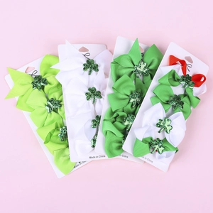 St. Patrick's Day clover hair bows set with four festive green patterns and shamrock clips