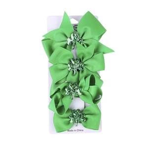 Set of 4 St. Patrick's Day green bow hair clips with sequin shamrock for kids
