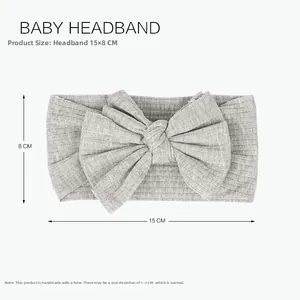 Gray ribbed baby headband with handmade knot bow detail, size 15x8 cm specification