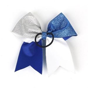 Detail of sequin cheerleader bow with blue and silver glitter fabric and elastic hair tie