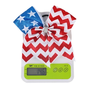Weight measurement of patriotic stars and stripes bow hair tie on a digital scale