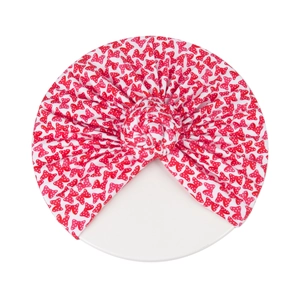 Bonnet bébé nœud donut avec motif à pois rouges sur tissu en maille élastique doux