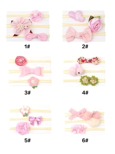 Detail view of 6 styles of pink baby nylon headbands with floral and bow decorations