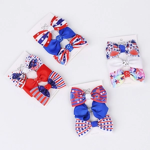 Detail of Fourth of July grosgrain ribbon hair bows set with patriotic stars and stripes