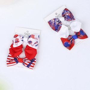 Detail of red white and blue bow hair clips for Independence Day on display cards
