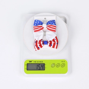 Detail view of Independence Day bow hair clips set showing 15.4g weight on scale