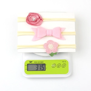 Detailed set of 3 pink nylon baby headbands with chiffon rose and crochet flowers