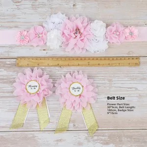 Detail of floral maternity sash and Mommy To Be badges with 30cm ruler for scale