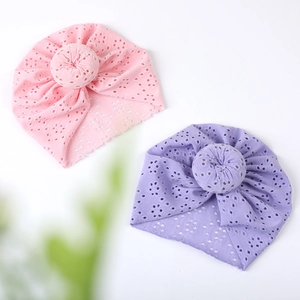 Breathable eyelet fabric baby turban hats with stylish donut knot detail in pink and purple