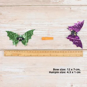 Halloween bat wing hair bow set in green and purple sequins with size measurement