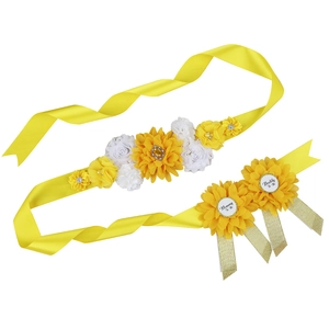 Detail of yellow flower belly sash and Daddy To Be, Mommy To Be corsage set