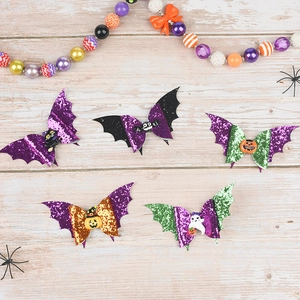 Five Halloween hair clips with sequins, bat wings, pumpkin and ghost resin charms
