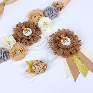 Detail of Mommy To Be floral sash and Daddy To Be badge set with cute bear motifs