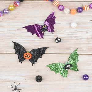 Three-piece Halloween bat hair clips with glitter textures and festive character motifs