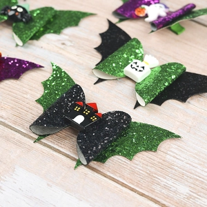 Halloween sequin bow hair clips featuring bat wings and pumpkin resin charms