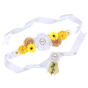 Detail of sunflower maternity sash and Daddy To Be badge set for baby shower party