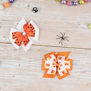 Halloween bow hair clips set featuring pumpkin and candy corn patterns for kids