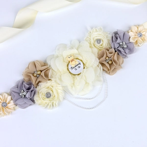 Detail of floral maternity sash with chiffon flowers and Mommy To Be bear tag