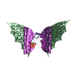 Halloween bat wing hair clip with purple glitter and cute ghost holding a pumpkin