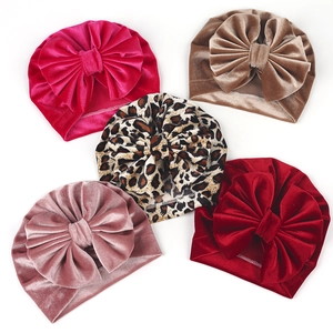 Five-pack baby velvet turban hats with large bows in various colors and leopard print