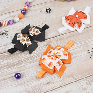 Three-piece Halloween bow headbands for girls with pumpkin prints on orange and black ribbon