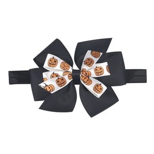 Detail of Halloween double-layer bow headband with orange pumpkin patterns for kids