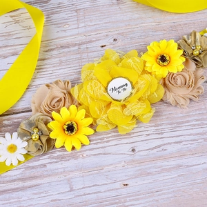 Detail of floral Mom To Be maternity sash with yellow sunflowers and elegant pearls