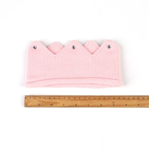 Pink knitted crown headband for babies with sparkling rhinestones and size measurement tool