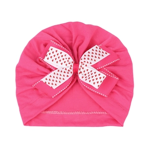 Bonnet turban rose pour bébé avec nœud double à motifs cœurs en tissu doux élastique