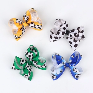 Fiocchi per capelli a tema calcio in giallo, nero, verde e blu per piccoli tifosi