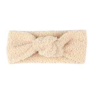 Detailstruktur des beigen Teddy-Fleece-Stirnbands mit weichem gedrehtem Knoten-Design