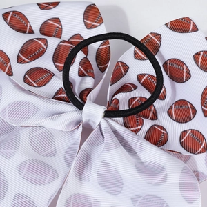 Detail of rugby pattern bow hair tie with black elastic band and durable stitching