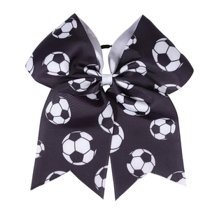 Detail of soccer pattern grosgrain ribbon hair bow for cheerleader fans with tail