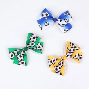 Three football pattern bow clips for kids in blue, green, and yellow soccer themes