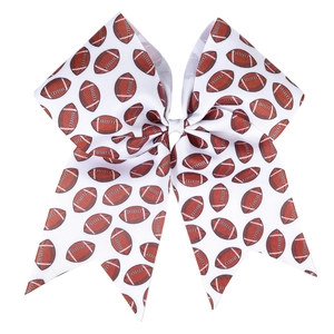 Macro detail of high-quality grosgrain bow hair tie with American football print patterns