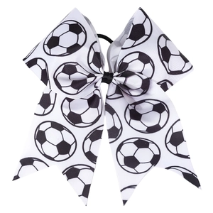 Macro view of soccer pattern grosgrain ribbon hair bow with durable elastic band