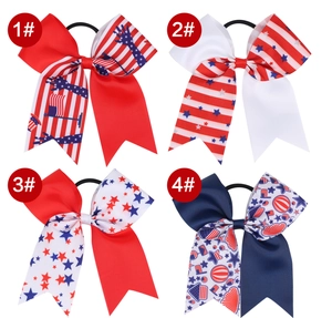Detail view of four patriotic Fourth of July grosgrain ribbon hair ties with elastic bands