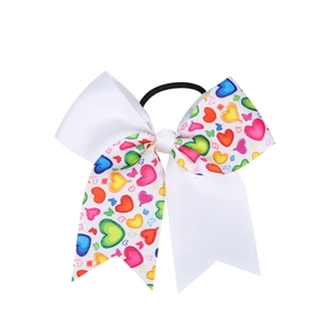 Élastique à cheveux pour enfants avec nœud à motifs cœurs colorés sur ruban blanc