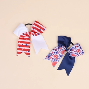 Close-up of American flag patriotic bow hair ties with ribbed texture and elastic bands