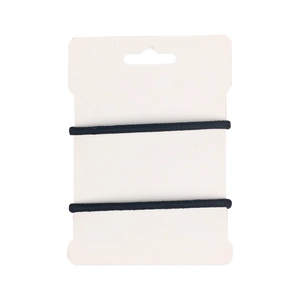 Close-up of black elastic hair ties set with woven texture on a white display card