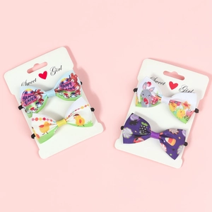 Detail of Easter hair bows with bunny and egg prints on ribbed fabric display cards
