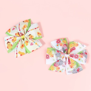 Close-up of Easter children bow hair clips with cute chicken and bunny patterns