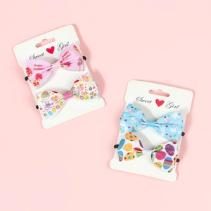Detail of Easter hair clips set with colorful rabbit and egg patterns on cards