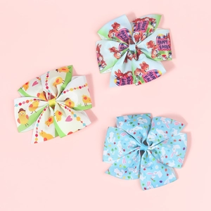 Detailed view of grosgrain Easter bow clips with bunny, chick and Happy Easter prints