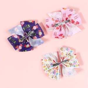 Three-piece Easter hair bow set featuring bunny and egg patterns on durable grosgrain ribbon