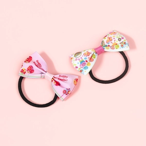 Close-up of Easter hair ties with Happy Easter text and cute bunny egg patterns