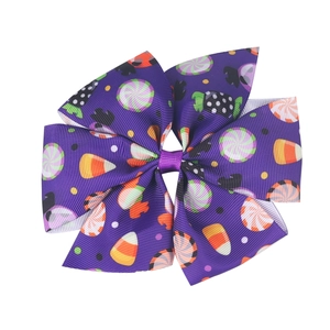 Easter purple grosgrain ribbon bow hair clip featuring colorful candy and lollipop patterns