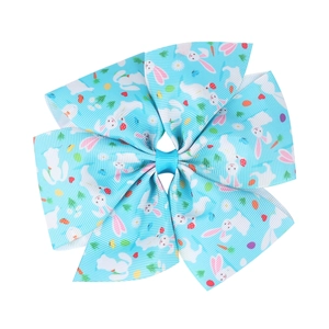 Easter kids hair bow with bunny and egg prints on light blue grosgrain ribbon