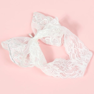 Bandeau élégant en dentelle blanche pour bébé avec motifs floraux et tissu doux