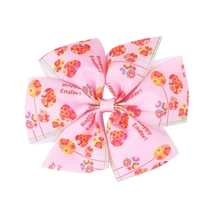 Pink grosgrain ribbon Easter bow hair clip with colorful egg patterns and Happy Easter text